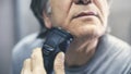 Mature man shaving in front of mirror Royalty Free Stock Photo