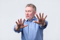 Mature man showing refusal sign. It is not for me Royalty Free Stock Photo