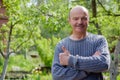 Mature man sitting in countryside Royalty Free Stock Photo