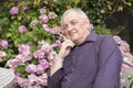 Mature man sitting in the garden Royalty Free Stock Photo