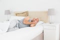 Mature man sleeping in bed