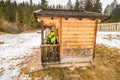 Mature man in small snowy hut