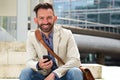 Mature man smiling with cellphone Royalty Free Stock Photo