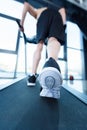 Mature man in sportswear exercising on treadmill in gym Royalty Free Stock Photo