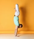 Mature man standing in yoga pose on straight arm Royalty Free Stock Photo