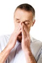 Mature man suffering from sinus pressure pain Royalty Free Stock Photo