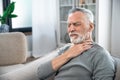 Mature man suffering from strong throat sore Royalty Free Stock Photo