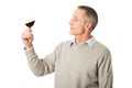 Mature man tasting red wine Royalty Free Stock Photo