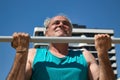 mature man training in the city with sports machines Royalty Free Stock Photo