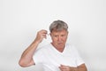 man using hearing aids to compensate hearing loss Royalty Free Stock Photo