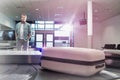 Mature man waiting for his suit case on baggage claiming area in airport Royalty Free Stock Photo