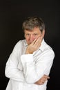 Mature man in white business shirt looking snotty