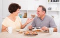 Mature man and woman talking and having lunch Royalty Free Stock Photo