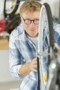 mature man working on bicycle wheel Royalty Free Stock Photo