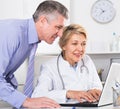 Manager and doctor reading news Royalty Free Stock Photo