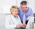 Manager and doctor reading news Royalty Free Stock Photo