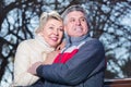 Mature married couple sitting on park bench Royalty Free Stock Photo