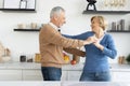 Mature married family couple dancing together at home Royalty Free Stock Photo