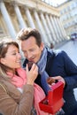 Mature middle-aged couple eating cakes in town Royalty Free Stock Photo