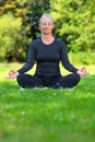 Mature Middle Aged Fit Healthy Woman Practicing Yoga Outside