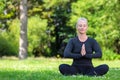 Mature Middle Aged Fit Healthy Woman Practicing Yoga Outside Royalty Free Stock Photo