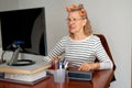 Mature middle aged in glasses using laptop typing email working at home office, lady searching information on internet Royalty Free Stock Photo