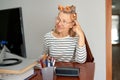 Mature middle aged in glasses using laptop typing email working at home office, lady searching information on internet Royalty Free Stock Photo