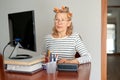 Mature middle aged in glasses using laptop typing email working at home office, lady searching information on internet Royalty Free Stock Photo