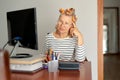 Mature middle aged in glasses using laptop typing email working at home office, lady searching information on internet Royalty Free Stock Photo