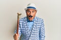 Mature middle east man with mustache wearing vintage and elegant fashion style scared and amazed with open mouth for surprise, Royalty Free Stock Photo