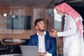 Mature Middle Eastern businessman wearing ghoutra in meeting