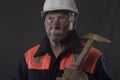 Mature miner covered in coal dust holding a pick axe Royalty Free Stock Photo