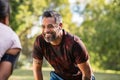 Mature mixed race man taking break after jog with his girlfriend Royalty Free Stock Photo