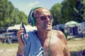 Mature modern man listens to music with headphones