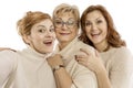 Mature mom with adult daughters laugh and take pictures Royalty Free Stock Photo