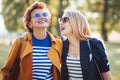 Mature mother and adult daughter enjoying a day in the park Royalty Free Stock Photo