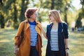 Mature mother and adult daughter enjoying a day in the park Royalty Free Stock Photo