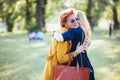 Mature mother and adult daughter hugging in the park Royalty Free Stock Photo
