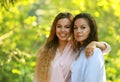 mature mother and adult daughter hugging in the park on a summer day Royalty Free Stock Photo