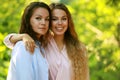 mature mother and adult daughter hugging in the park on a summer day Royalty Free Stock Photo