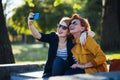 Mature mother and adult daughter taking selfie Royalty Free Stock Photo