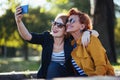 Mature mother and adult daughter taking selfie Royalty Free Stock Photo