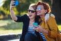 Mature mother and adult daughter taking selfie Royalty Free Stock Photo