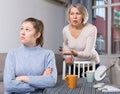 Mature mother scolds adult daughter