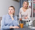 Mature mother scolds adult daughter