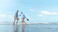 Mature mother and son dancing on the beach Royalty Free Stock Photo