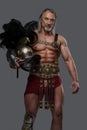 Mature muscular gladiator with grey beard lightweight armor