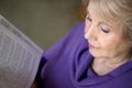 Mature older woman reading a book Royalty Free Stock Photo