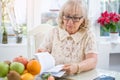 A mature older woman reading a book Royalty Free Stock Photo