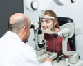 Optician doing eye examination